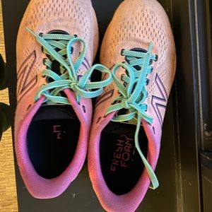 Pink and orange New Balance running shoes with fresh foam